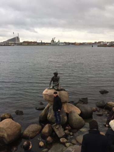 Little Mermaid sculpture is displayed on a rock by the waterside at the Langelinie promenade in Copenhagen.