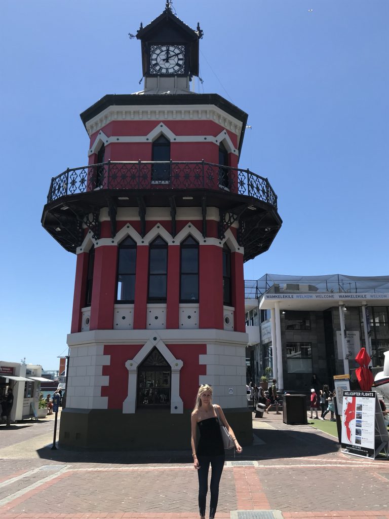 Laura reluctantly posing for a picture next to V and A Waterfront Clocktower